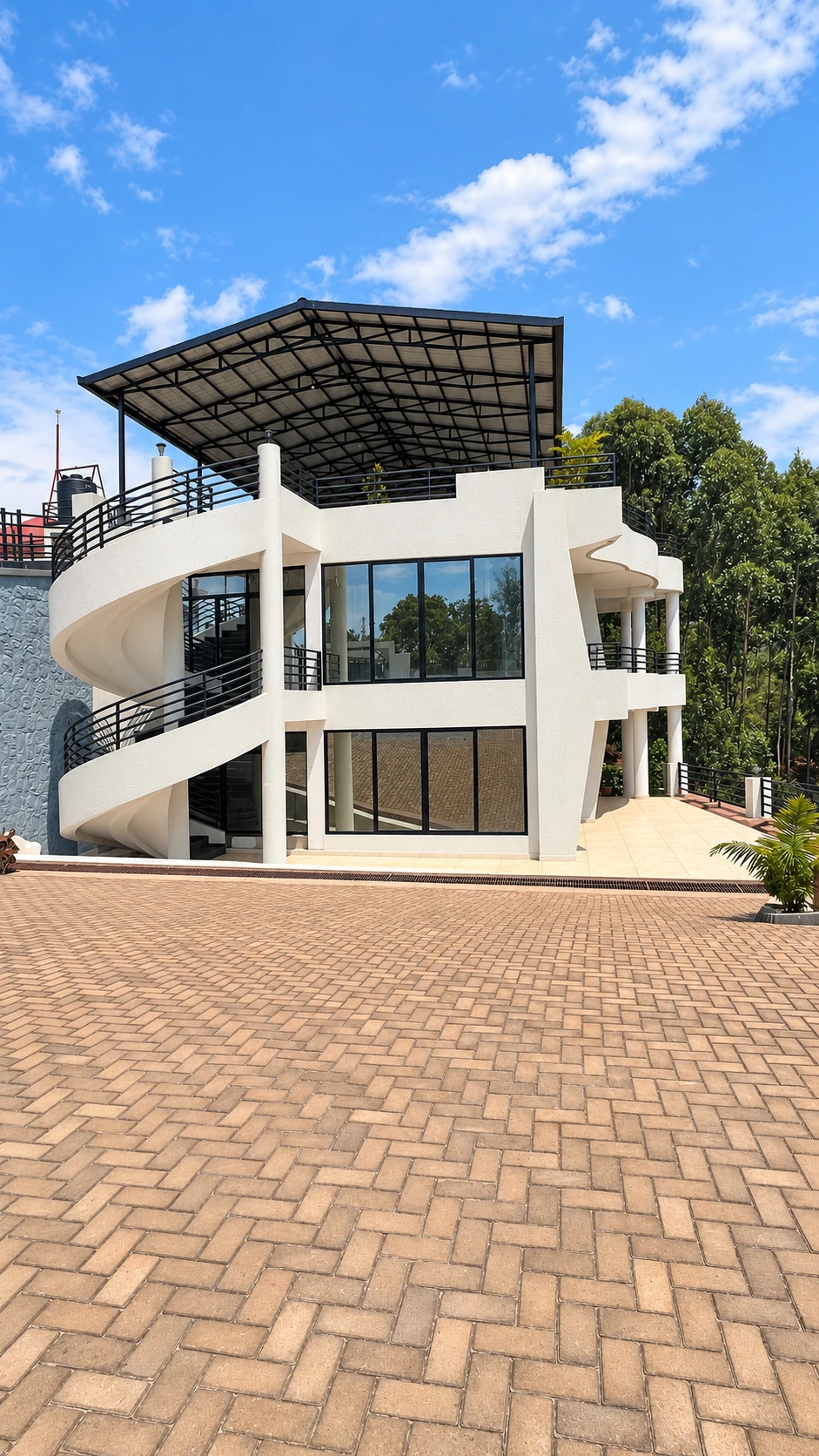 Connection Hotel — Curved staircase and covered terrace